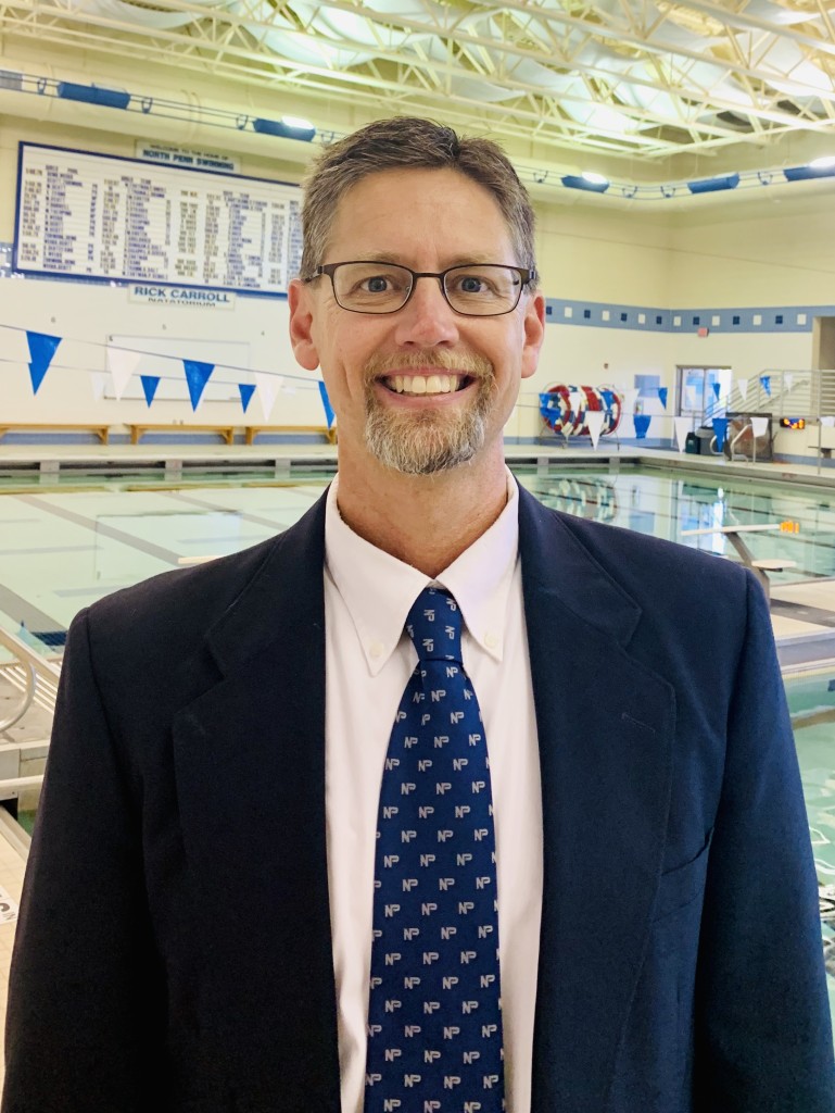 Brian Faikish picture standing on deck in the NPHS Pool